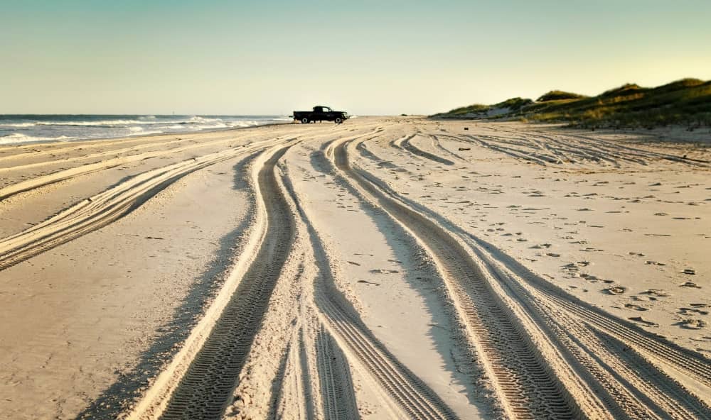 Tyre tracks on the beach.