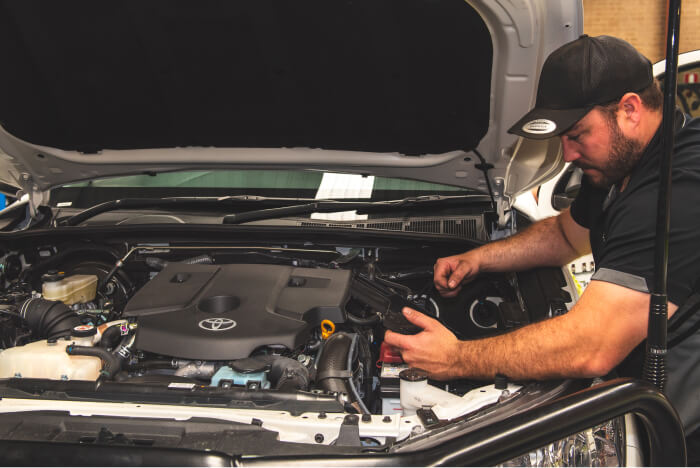 Elite Tune 4WD mechanic performing a mechanical inspection